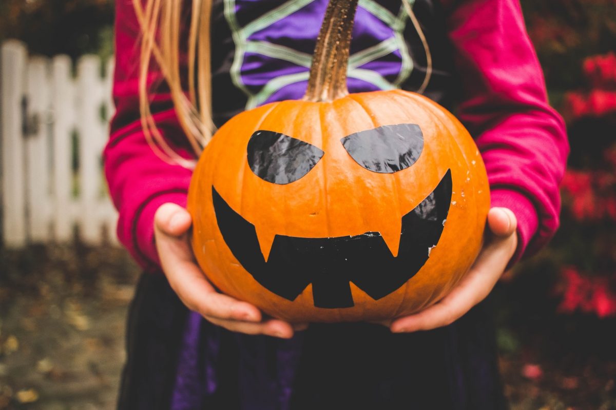 Child holding pumpkin, Bolthole Retreats