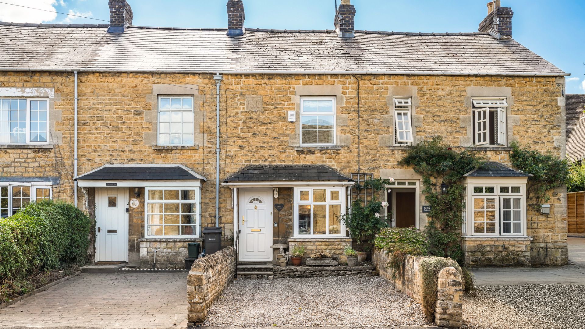 Dolls Cottage's Cotswold stone exterior.