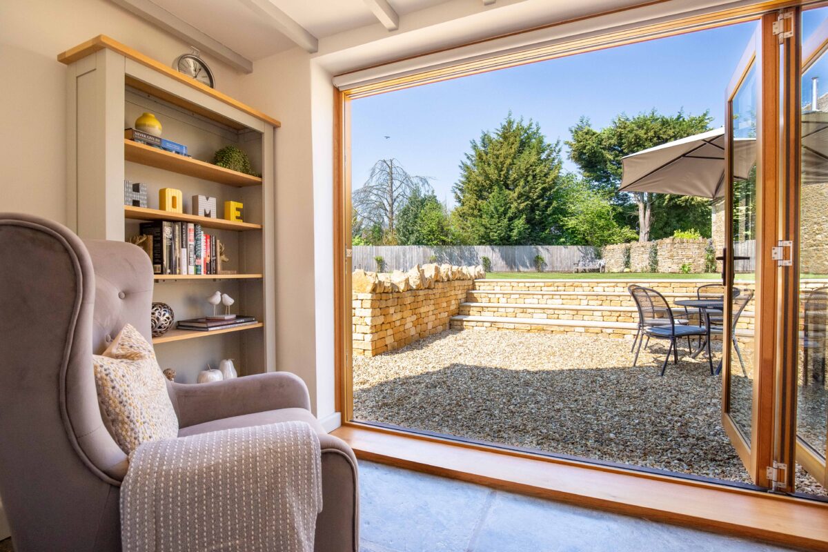 Garden Cottage sitting room with bi-fold doors opening onto the garden