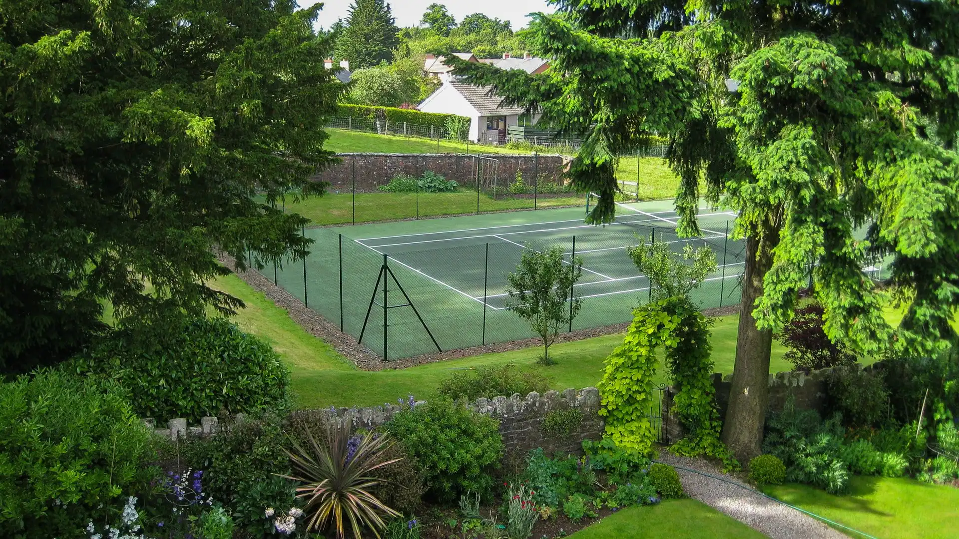 Host a mini-Wimbledon with your family at the shared tennis court.