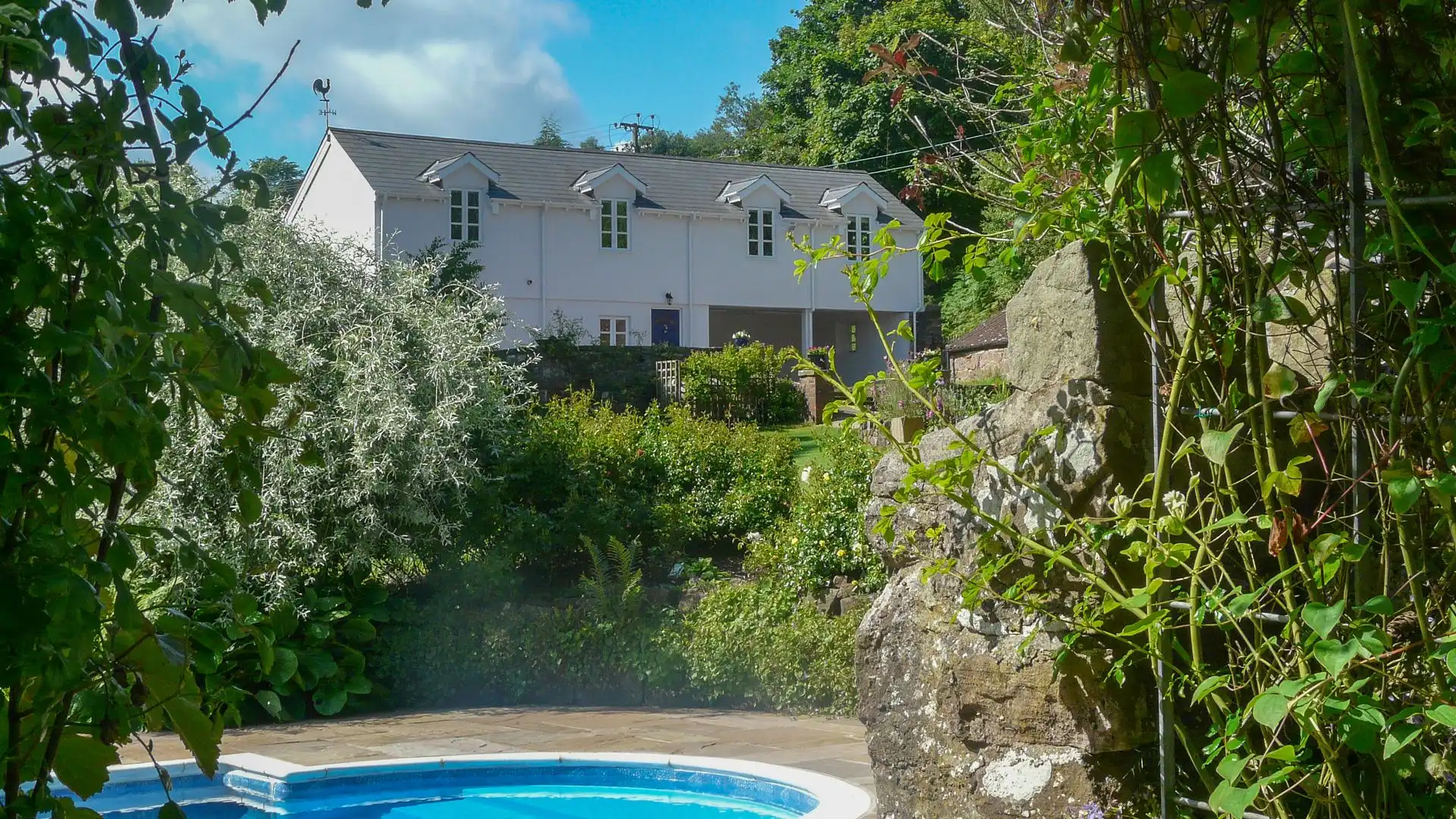 Set amongst beautiful gardens, Buckstone House Coach House has shared use of an outdoor swimming pool.