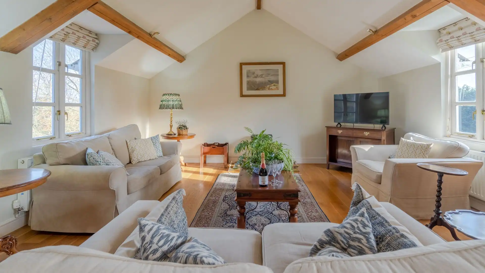 The high ceiling has exposed beams.
