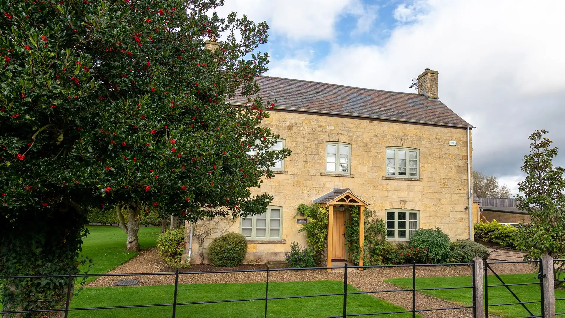 Todenham Farmhouse has a golden glow from its Cotswold stone