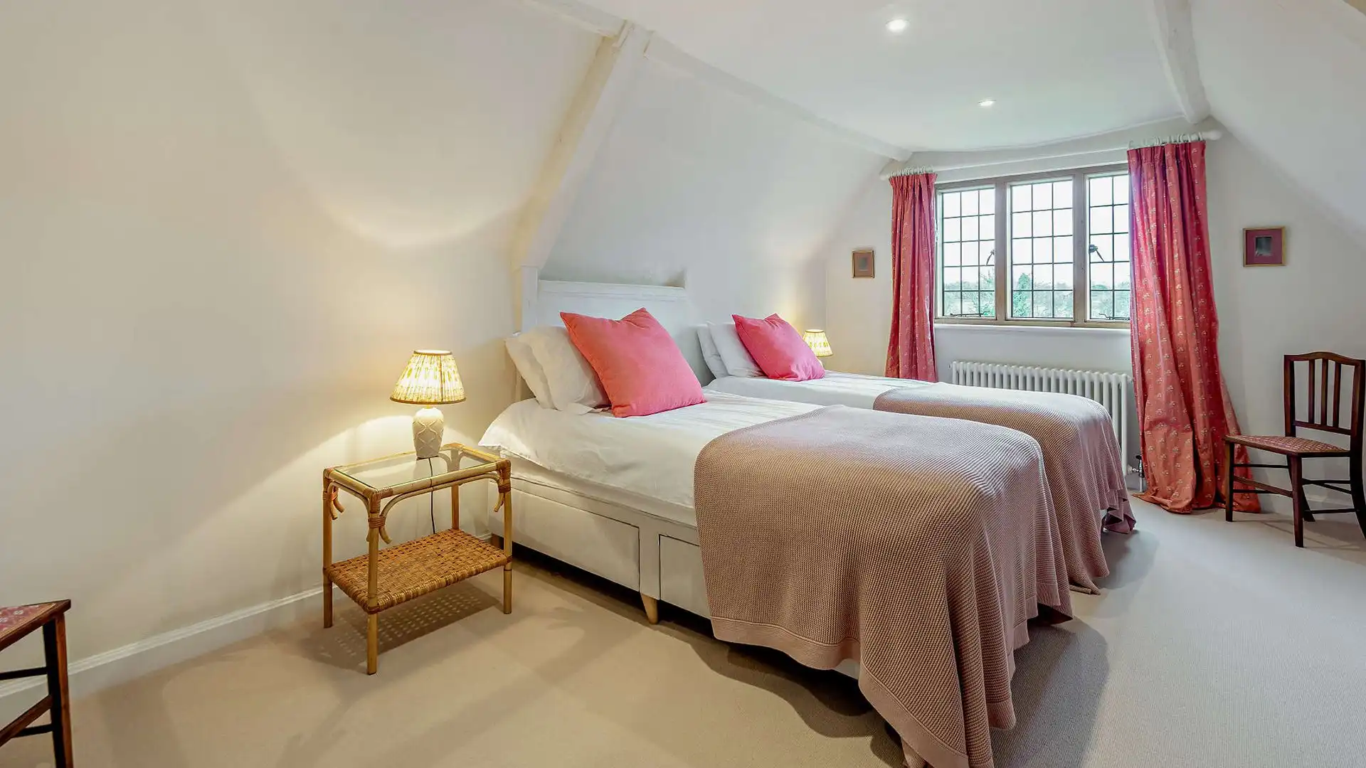 At one end of the house, bedroom five has two single beds