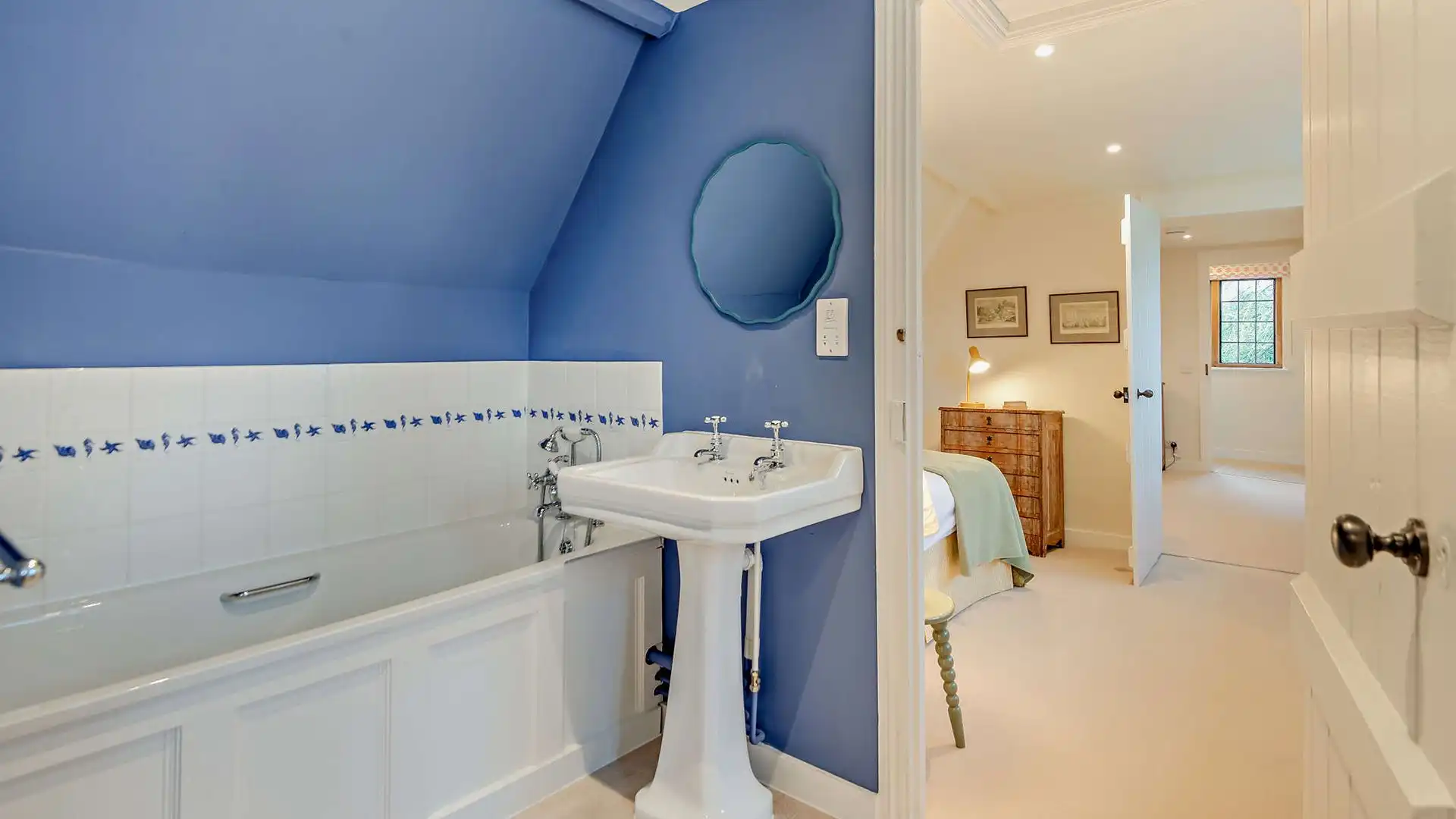 Accessed from the landing and leading through to bedroom six, the second bathroom has a bath with a hand-held shower, WC and basin
