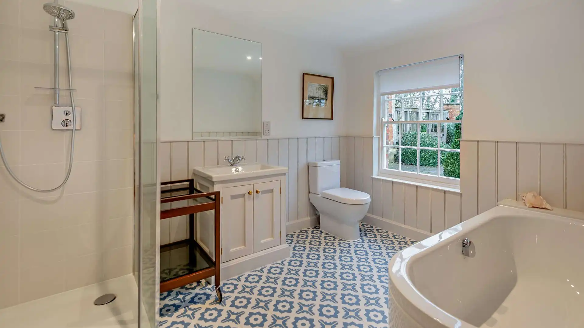 Sink into the bath at the end of a busy day and look out across the topiary in the garden