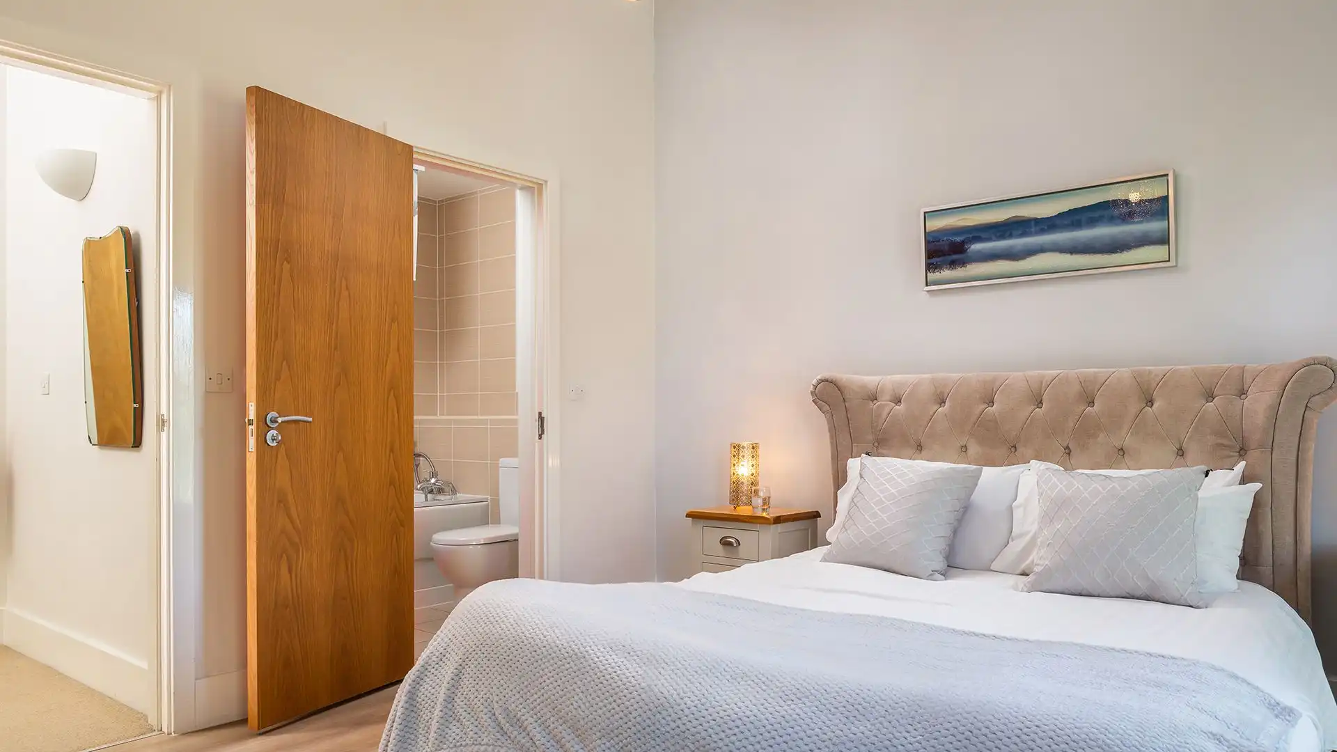 The master bedroom has a king-size bed and en-suite bathroom