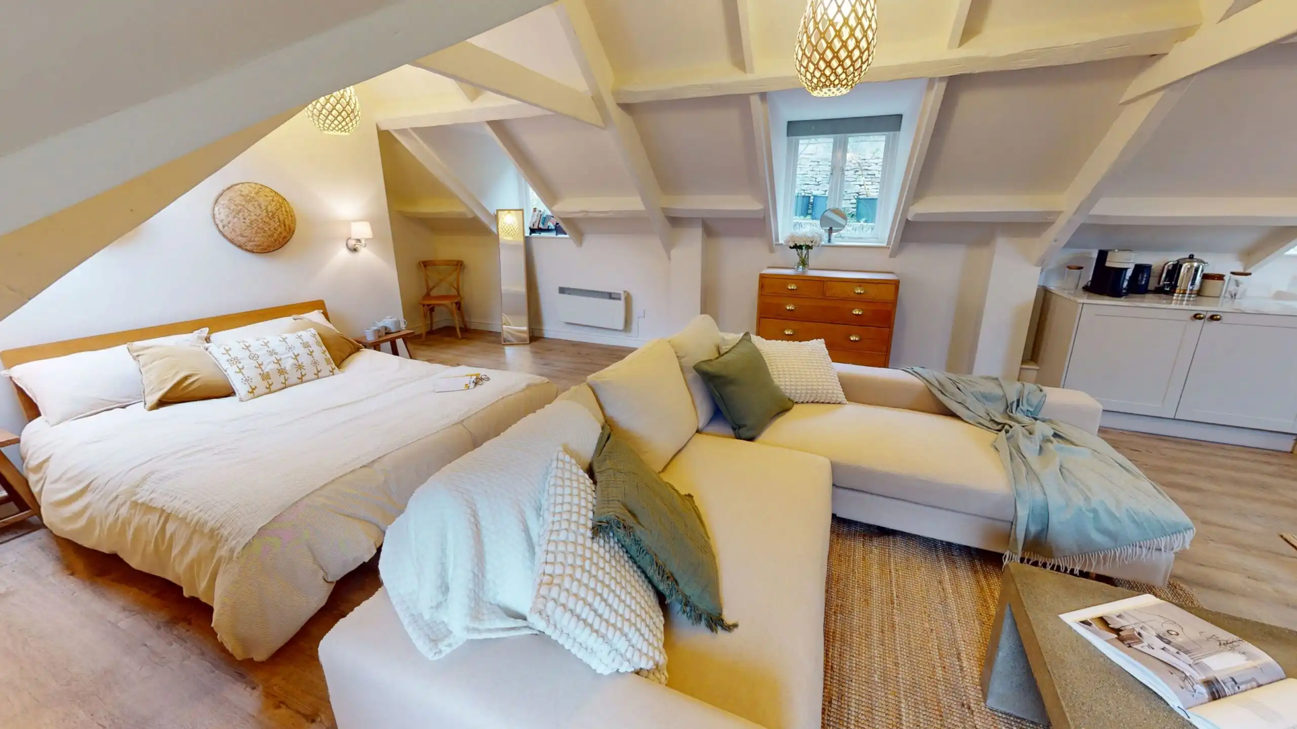 Beams adorn the high ceiling and rustic elements add interest. 