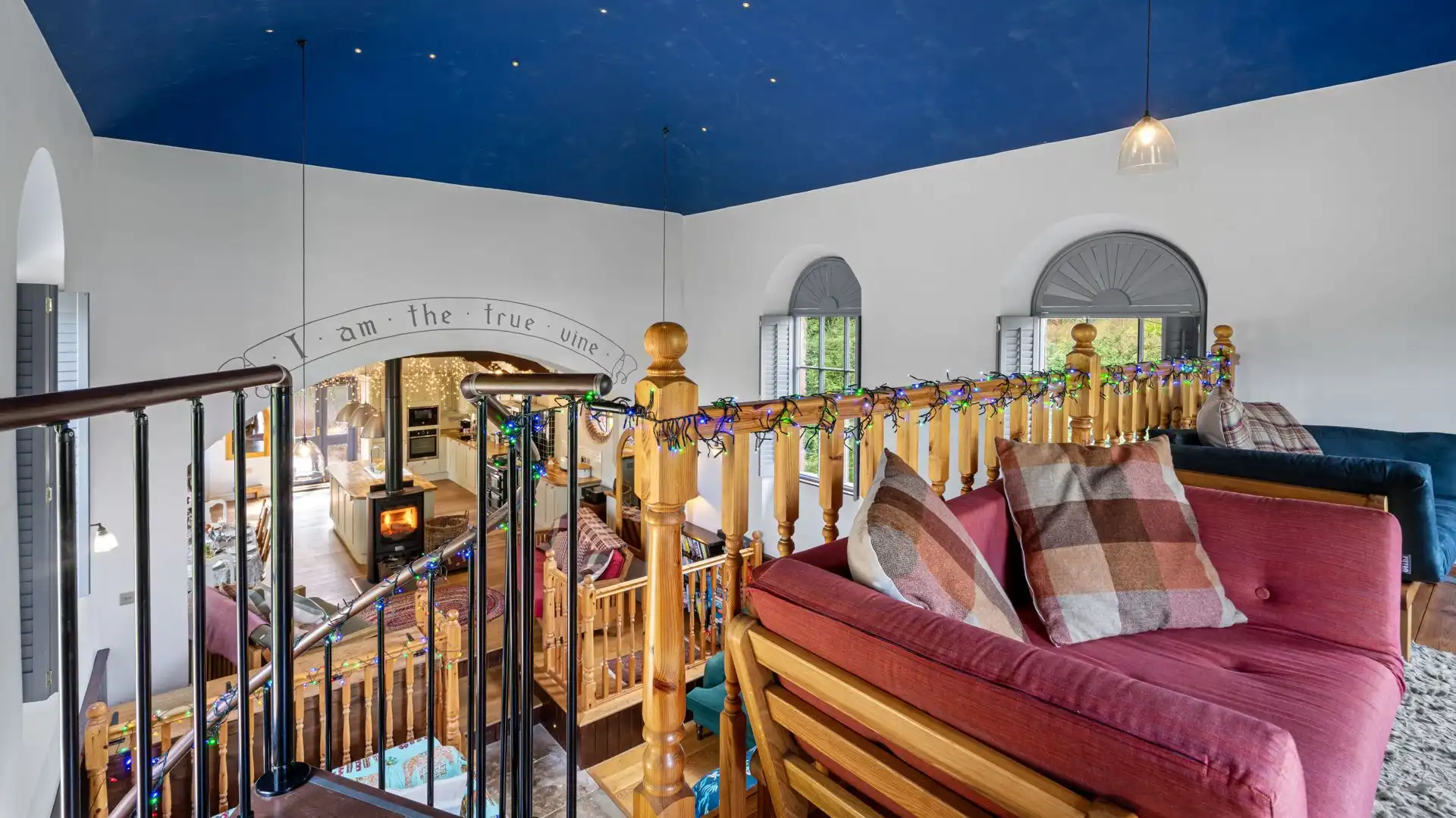 Up an open tread spiral staircase is a mezzanine with two single futons. 