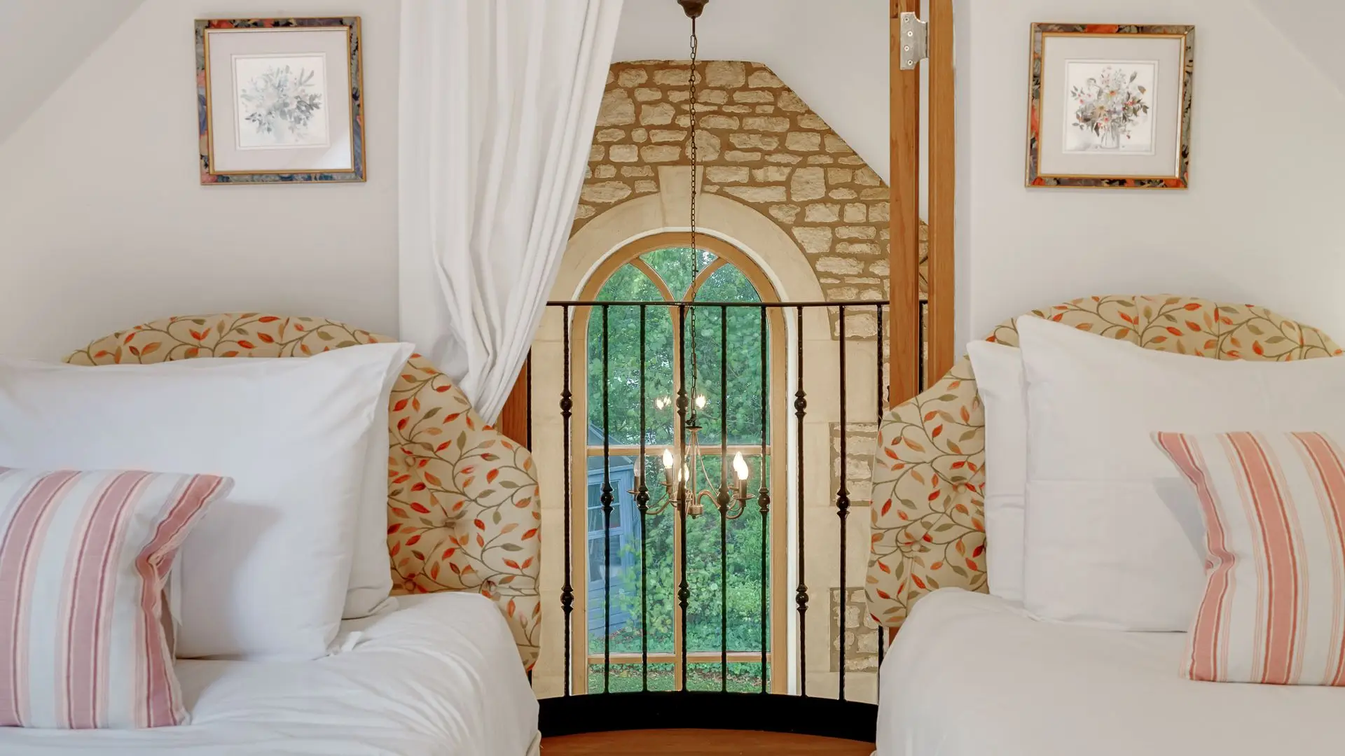 The quirky Juliet balcony in bedroom three looks over the open plan living area.