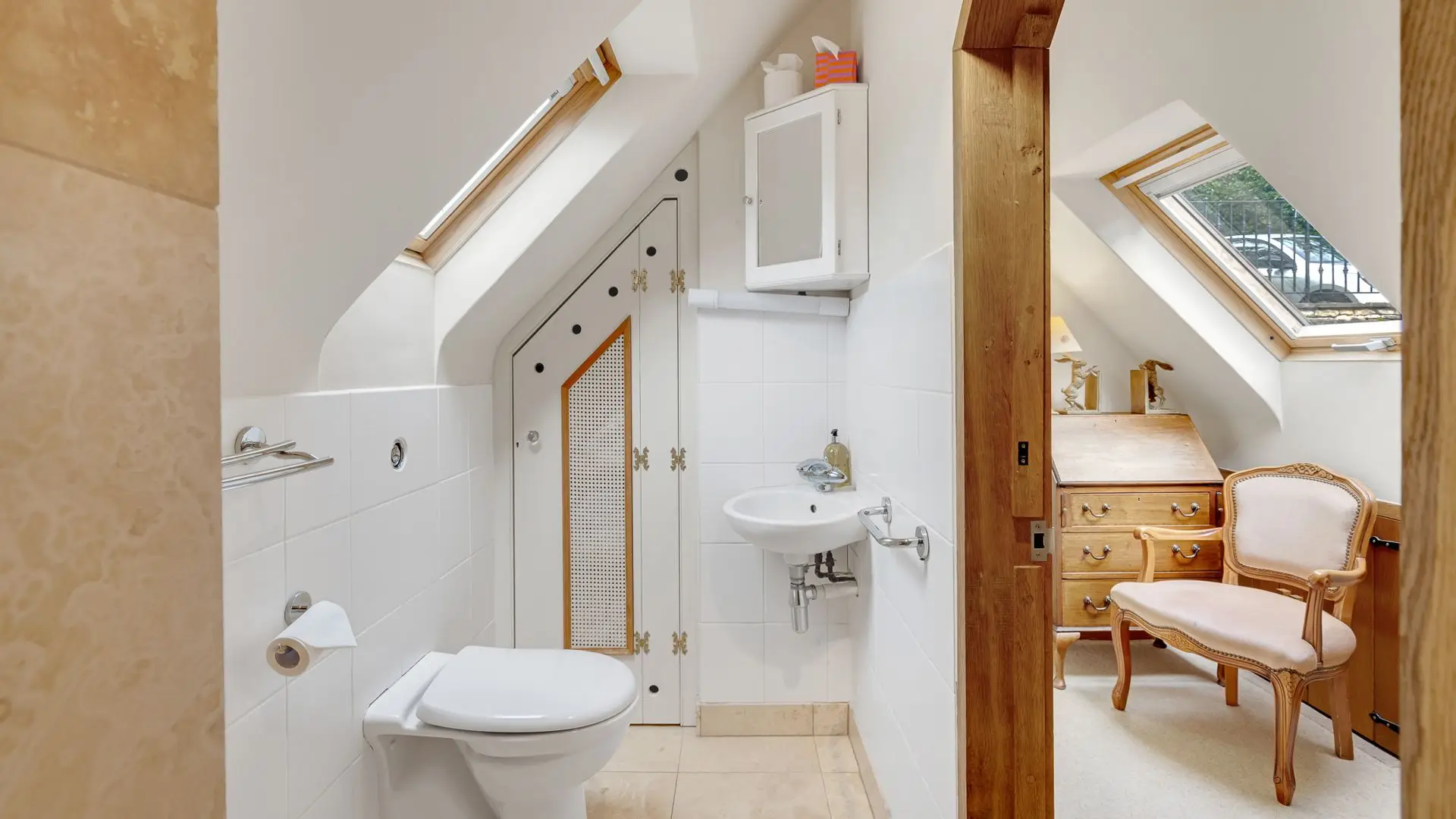 The first floor shower room has a step-in shower with a seat, WC and basin.