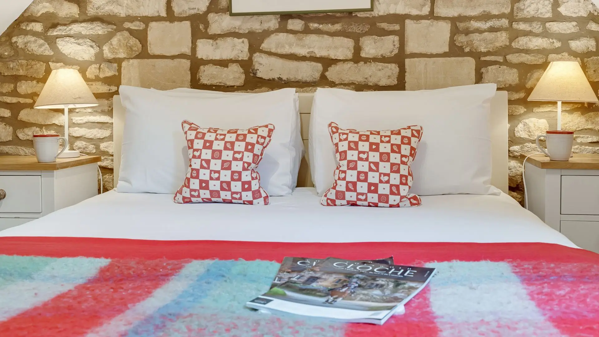 A feature stone wall adds warmth to this room.