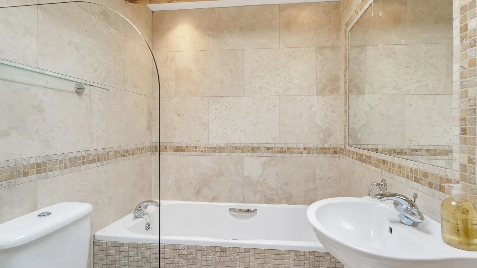 The en-suite has a bath, shower, WC and basin.