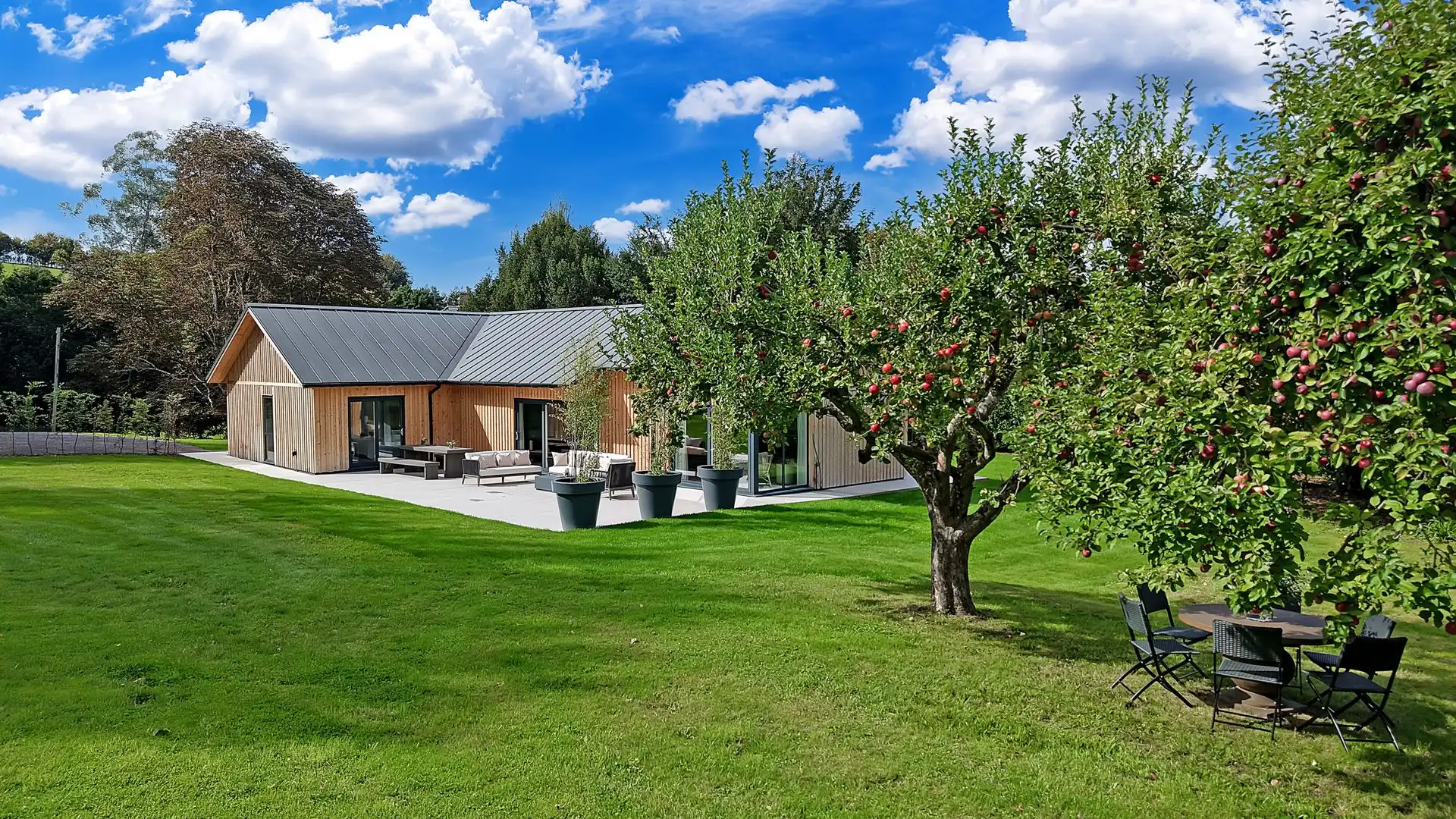 Sitting within an acre of land, Lambs Lawn has a spectacular garden. A terrace surrounds the house with space to dine and lounge. 