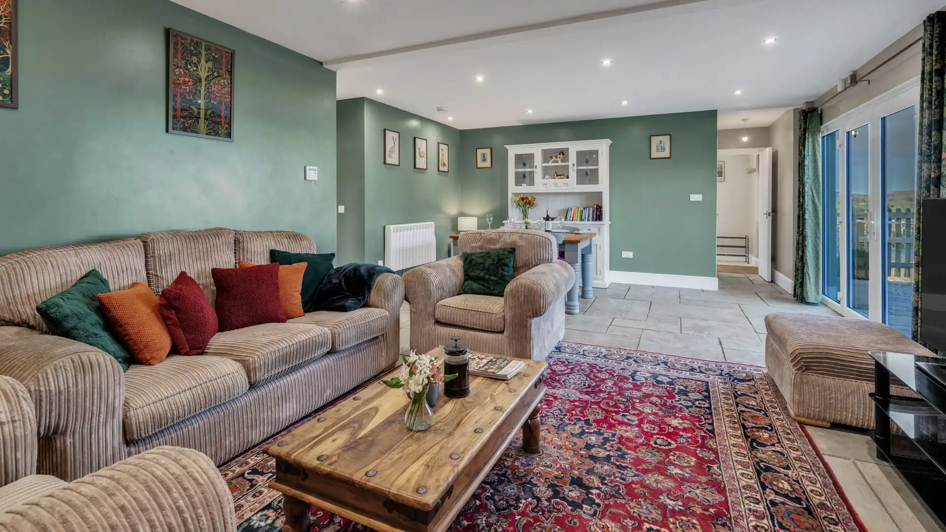 Looking over the farmyard, the open plan living area is both cosy and spacious. 