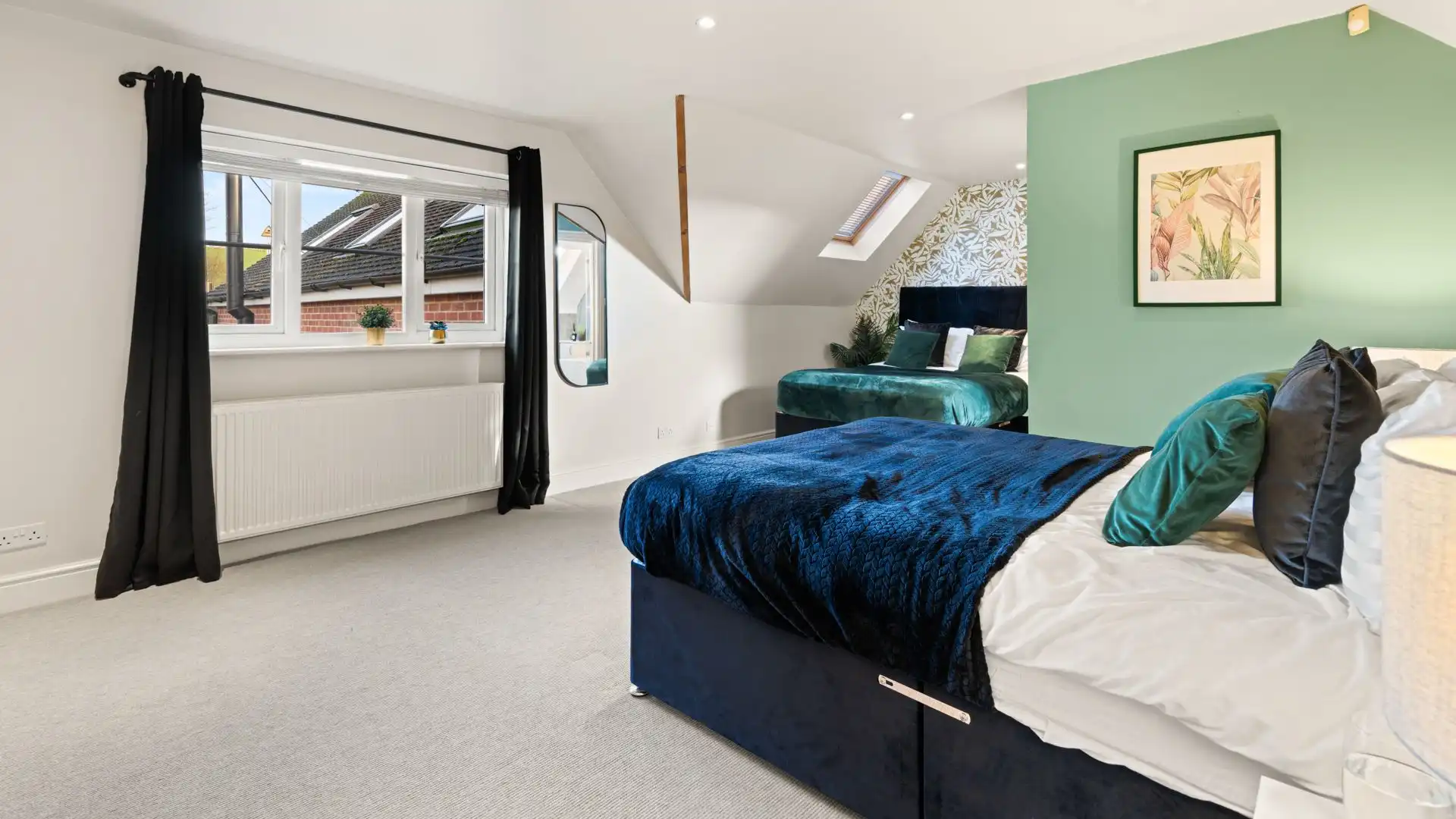 The largest bedroom is a family room with two double beds. 
