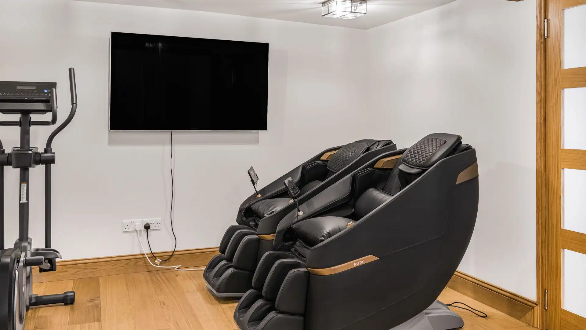 Zero gravity massage chairs offer the ultimate relaxation after a workout in the home gym.