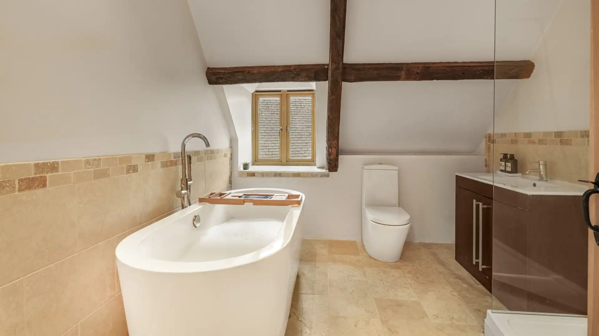 A roll-top bath offers the chance for an indulgent bubble bath during your stay.