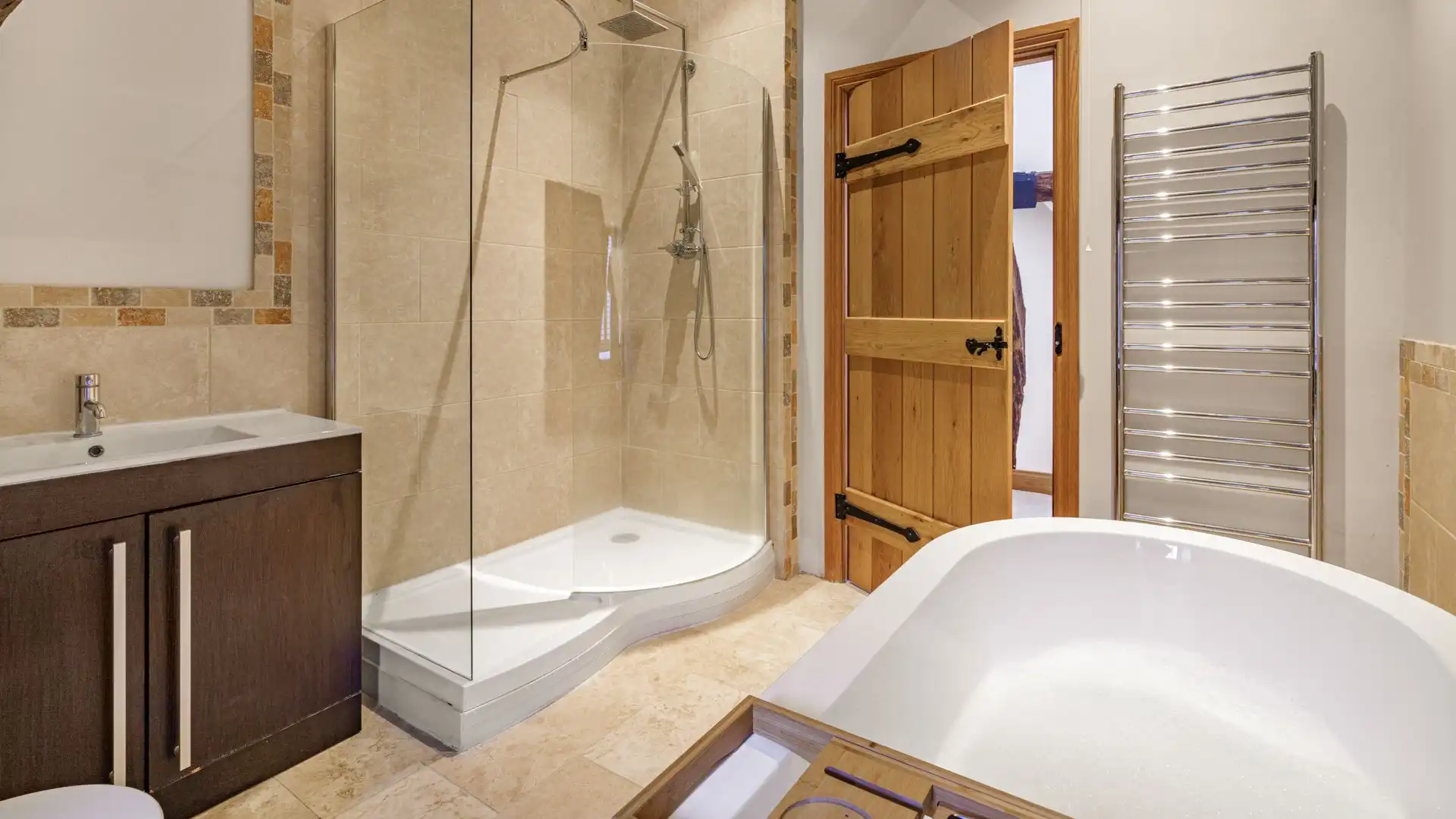 A rainfall shower provides an extra luxurious experience in the walk-in shower.