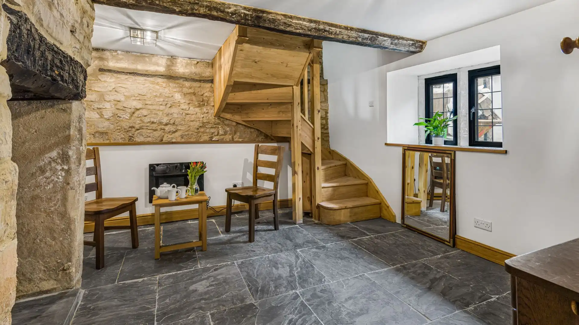 A cosy nook for two under a stairwell.