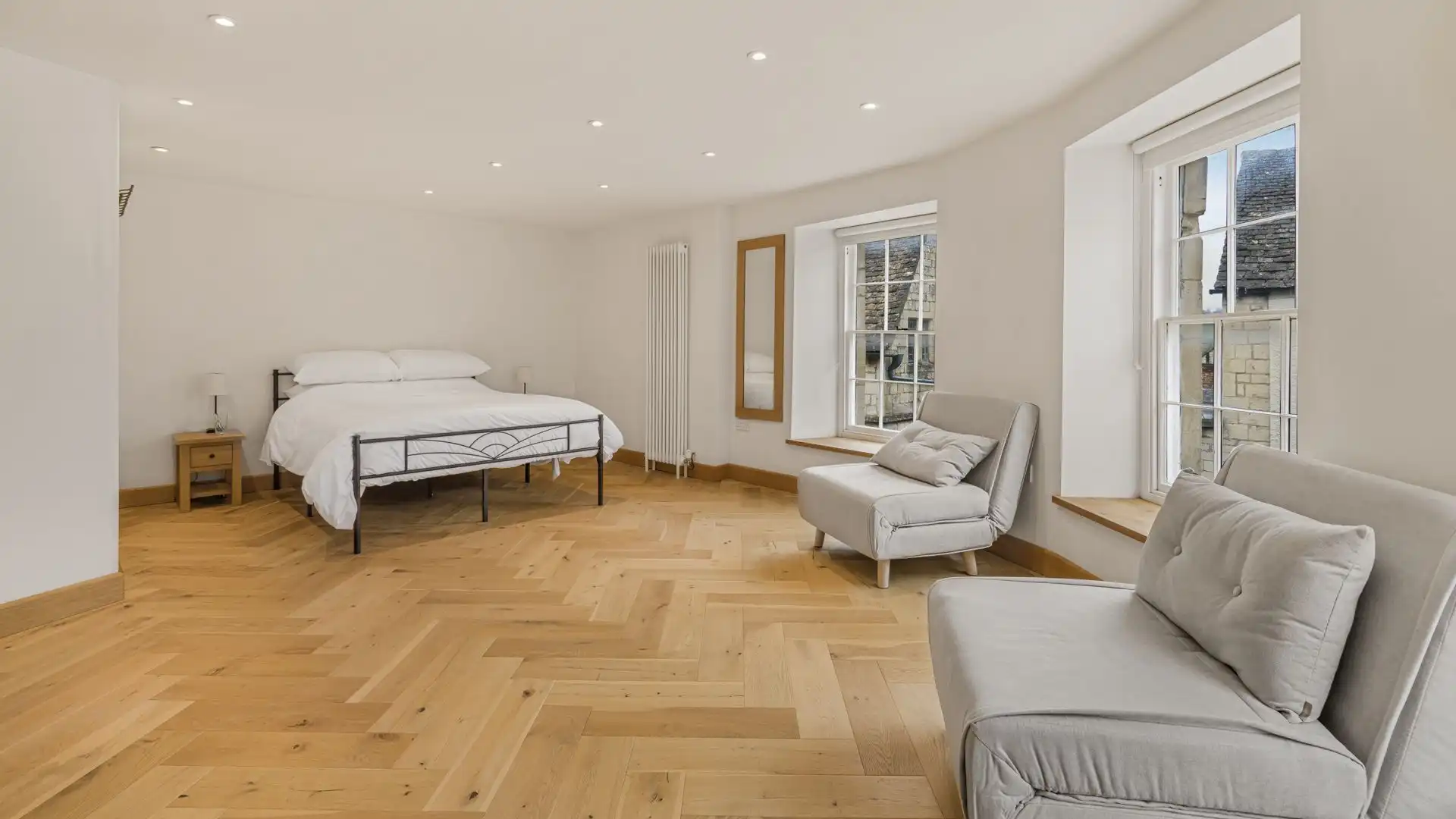 One of the largest bedrooms, this has unique triple-aspect curved windows.