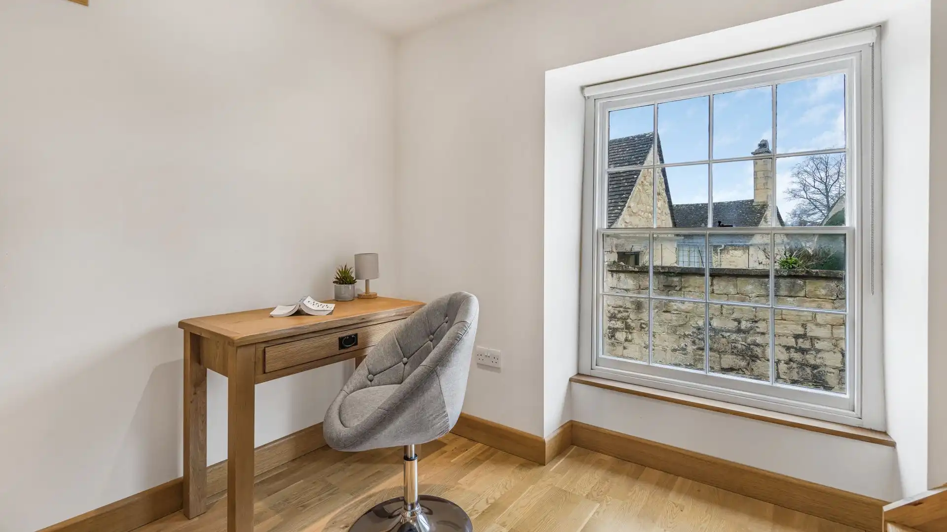 A quiet desk area with sweeping views over the church yard.