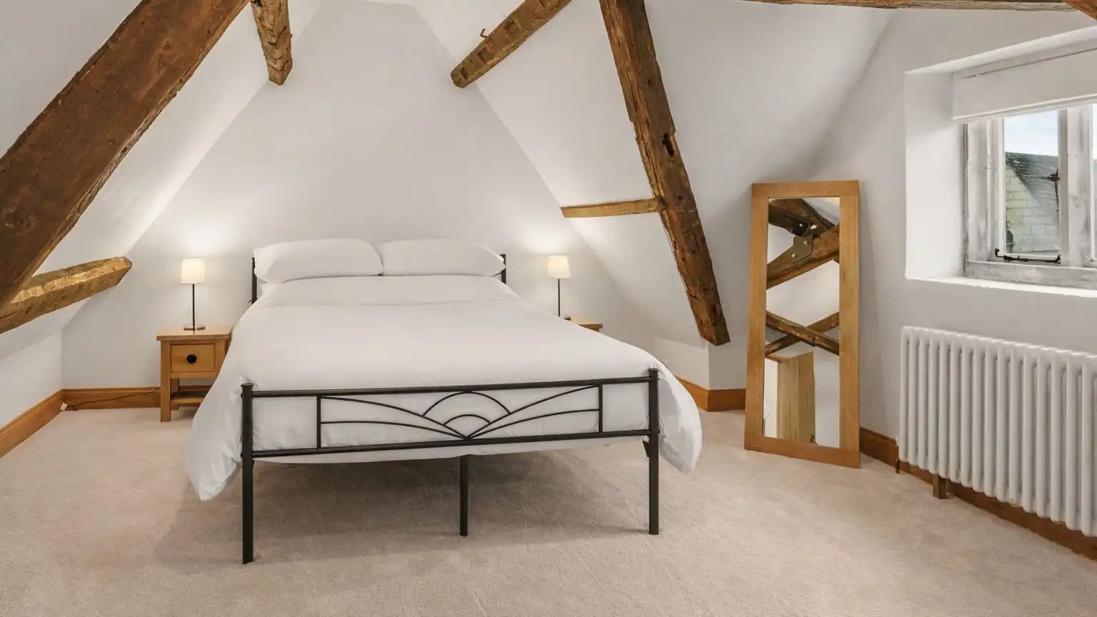 Bedrooms have cool, crisp linens and calming neutral tones.