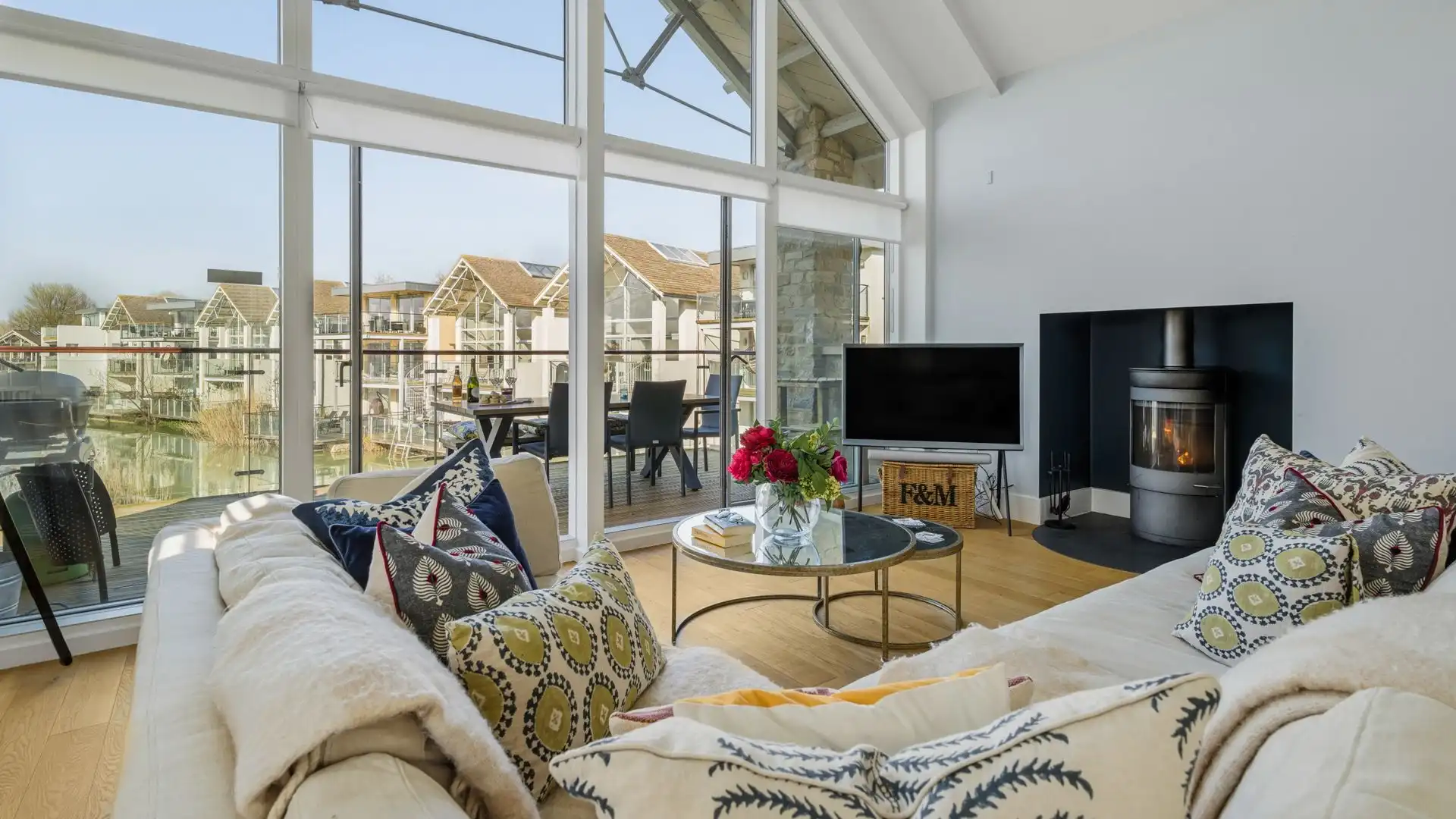 Thoughtfully arranged to capture the lake views, the open-plan living space sits on the first floor. 