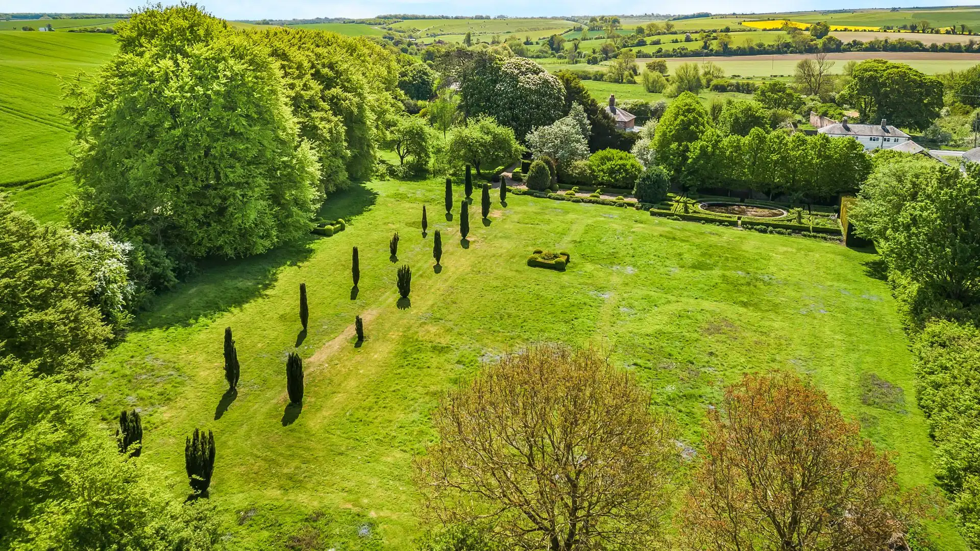 Outside, the breathtaking gardens are a true highlight of this property.