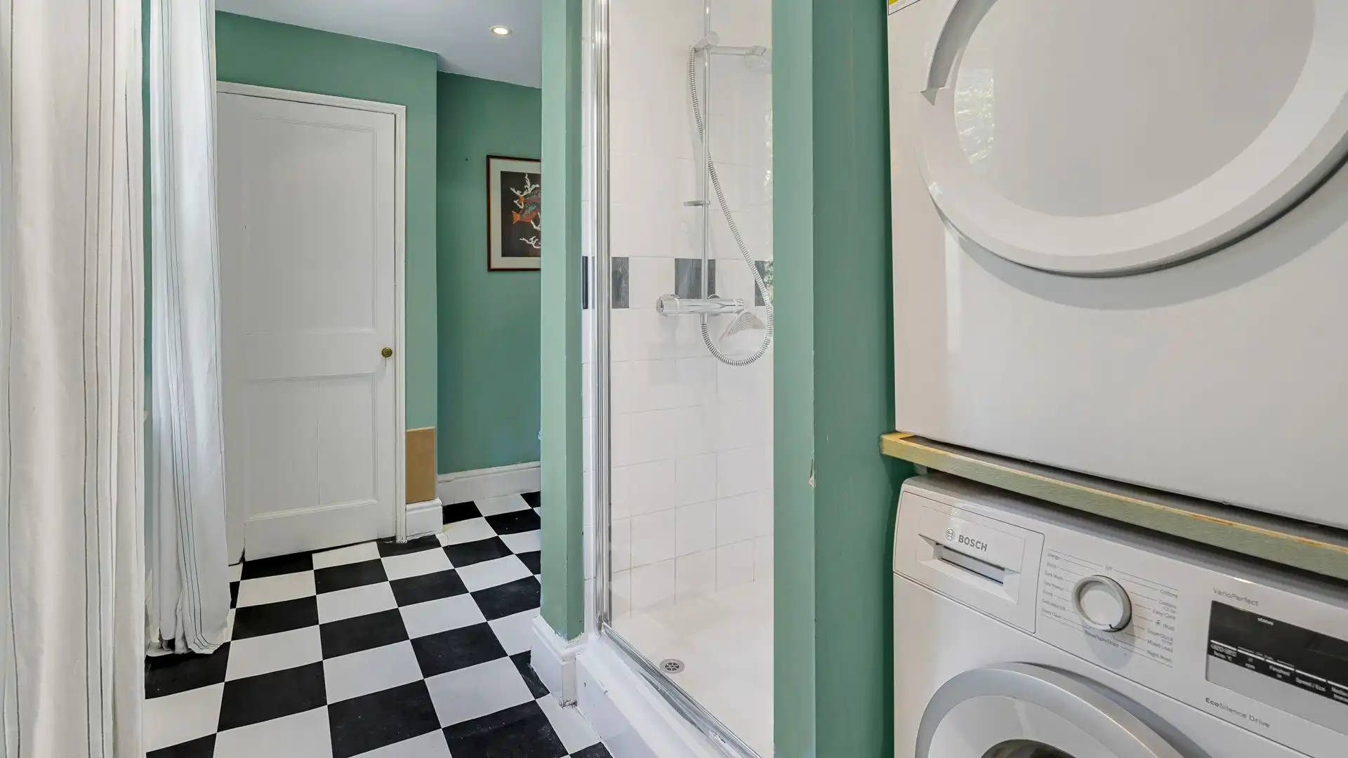This useful room doubles as a shared shower and utility room. 