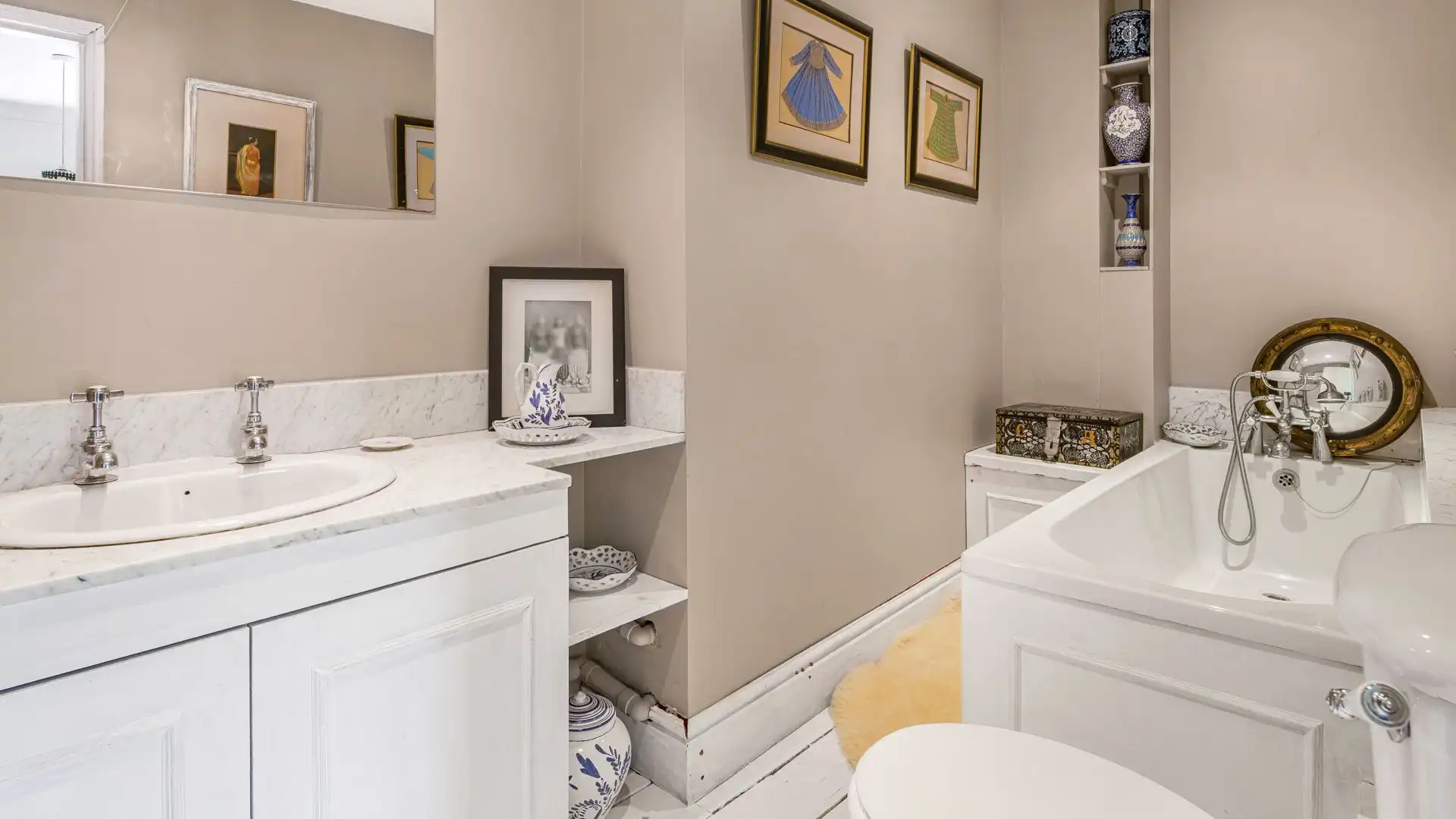 Bedroom three boasts an en suite with bath, WC and basin.