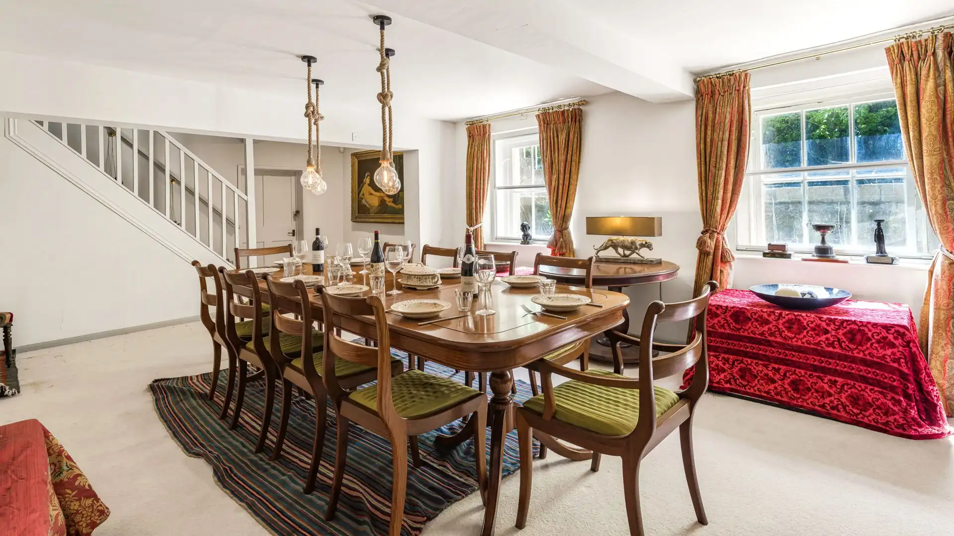 Impressive dining room with extensive dining table seating ten.
