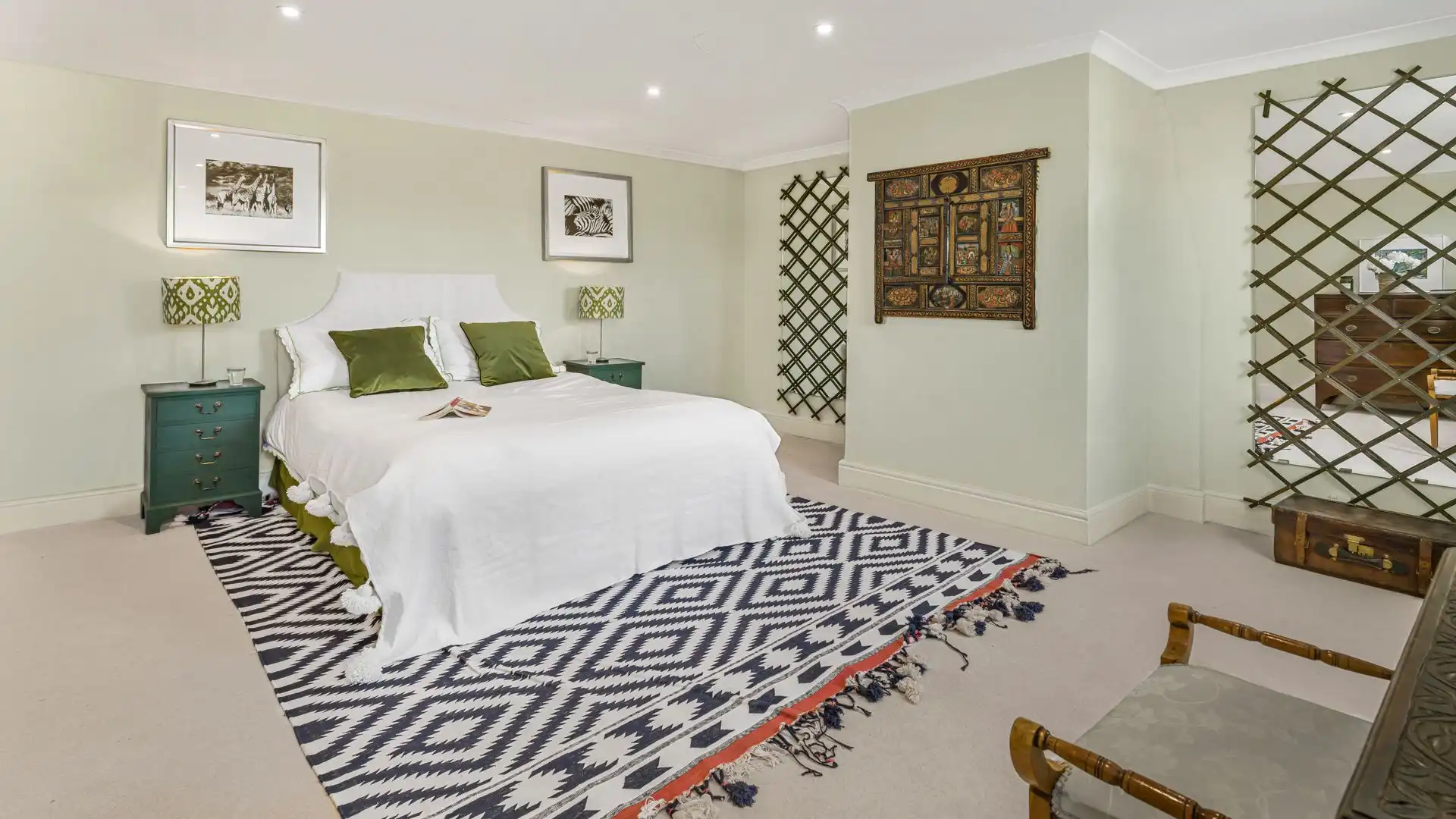 A further spacious room with king-size bed.