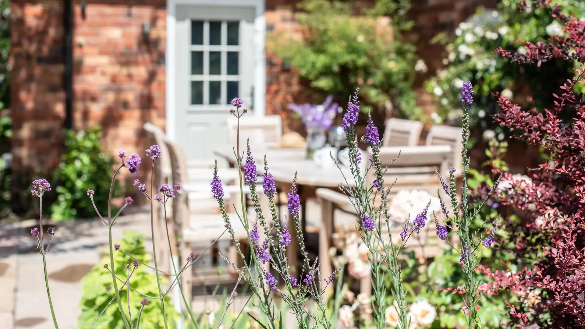 The private dining terrace seating 6 is surrounded by roses and lavender, perfect for a spring or summer getaway