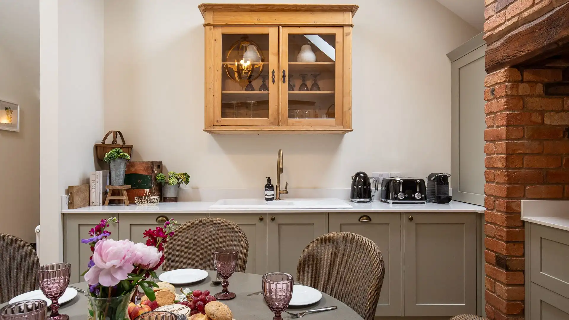 The beautiful sage green kitchen is fully-equipped with all the essentials for a family or group getaway
