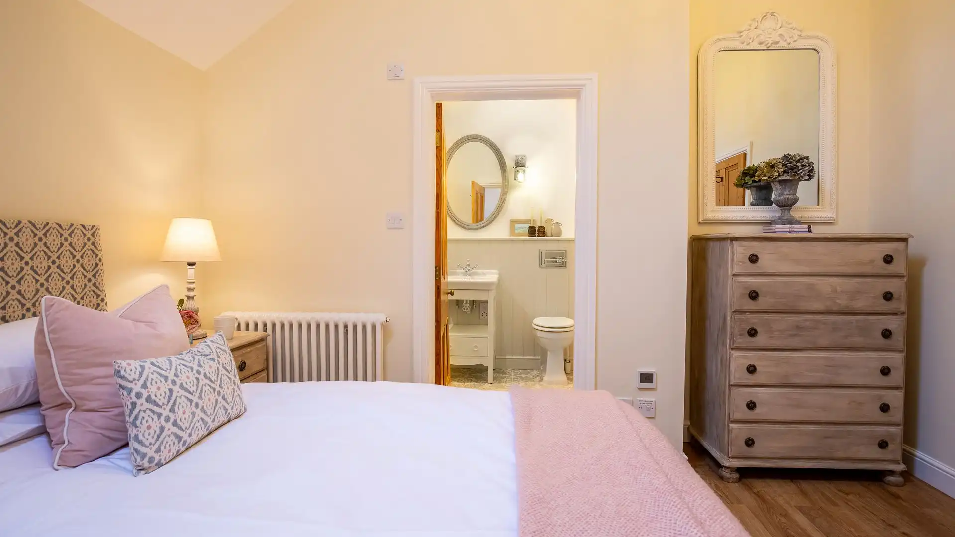 Bedroom three has a double bed, chest of drawers and en suite bathroom with bath