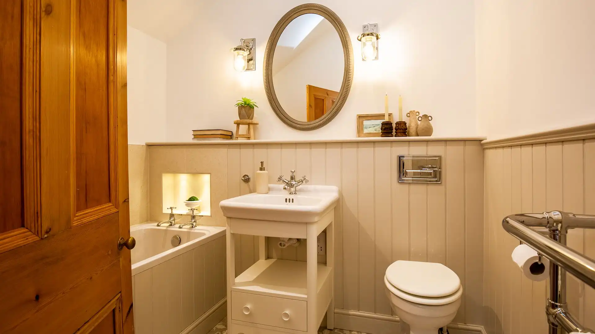 Bedroom three's beautiful en suite has a bath, basin and WC 