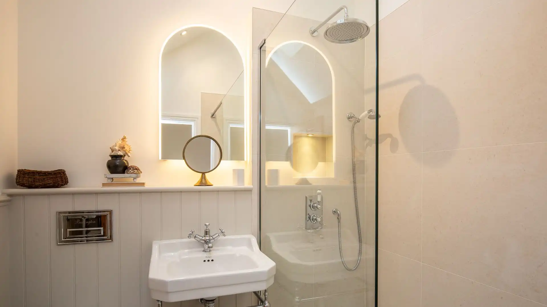 Bedroom two's en suite has a walk-in shower, basin and WC