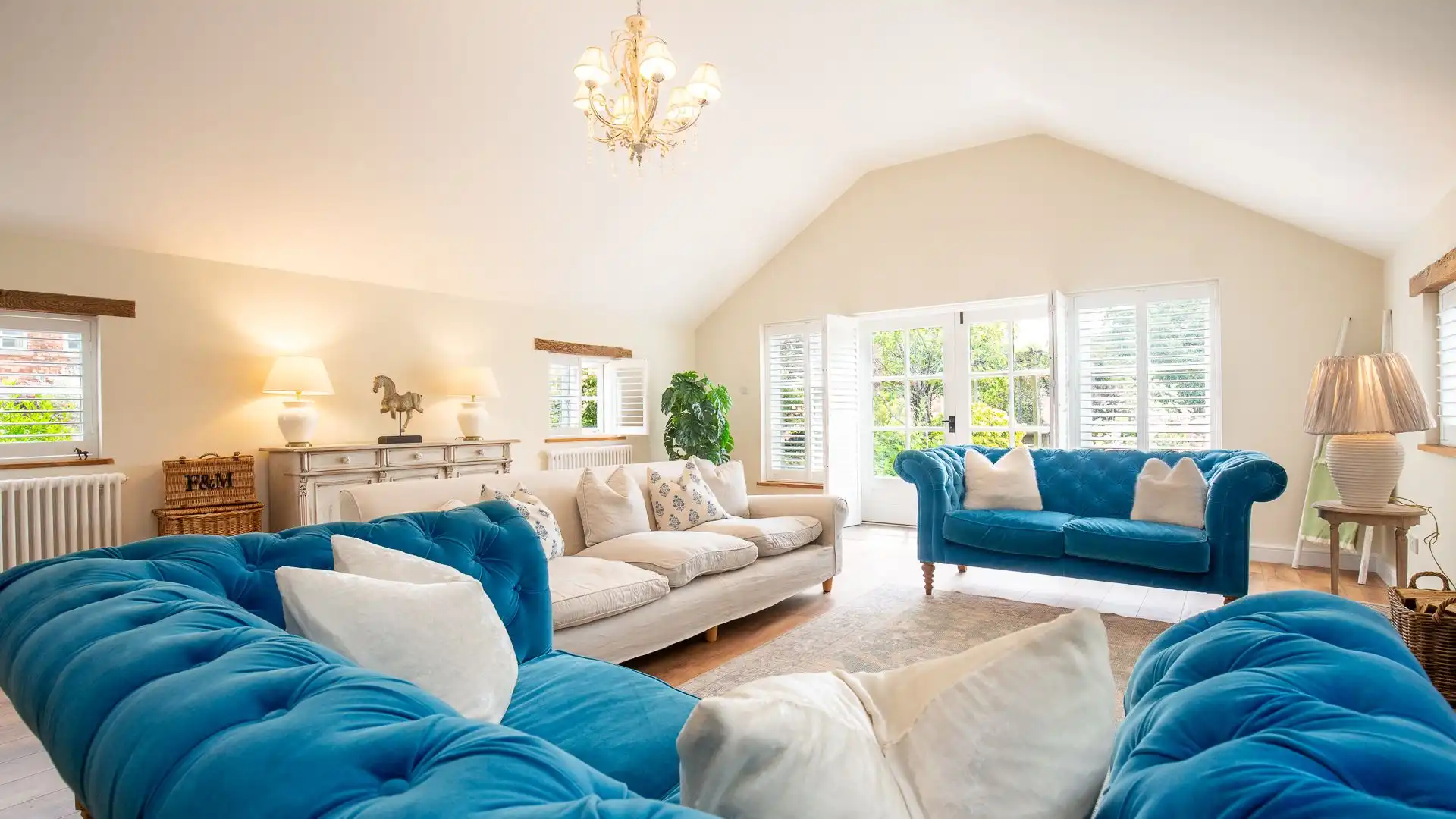 The large living has plenty of sofa seating and views of the pastures