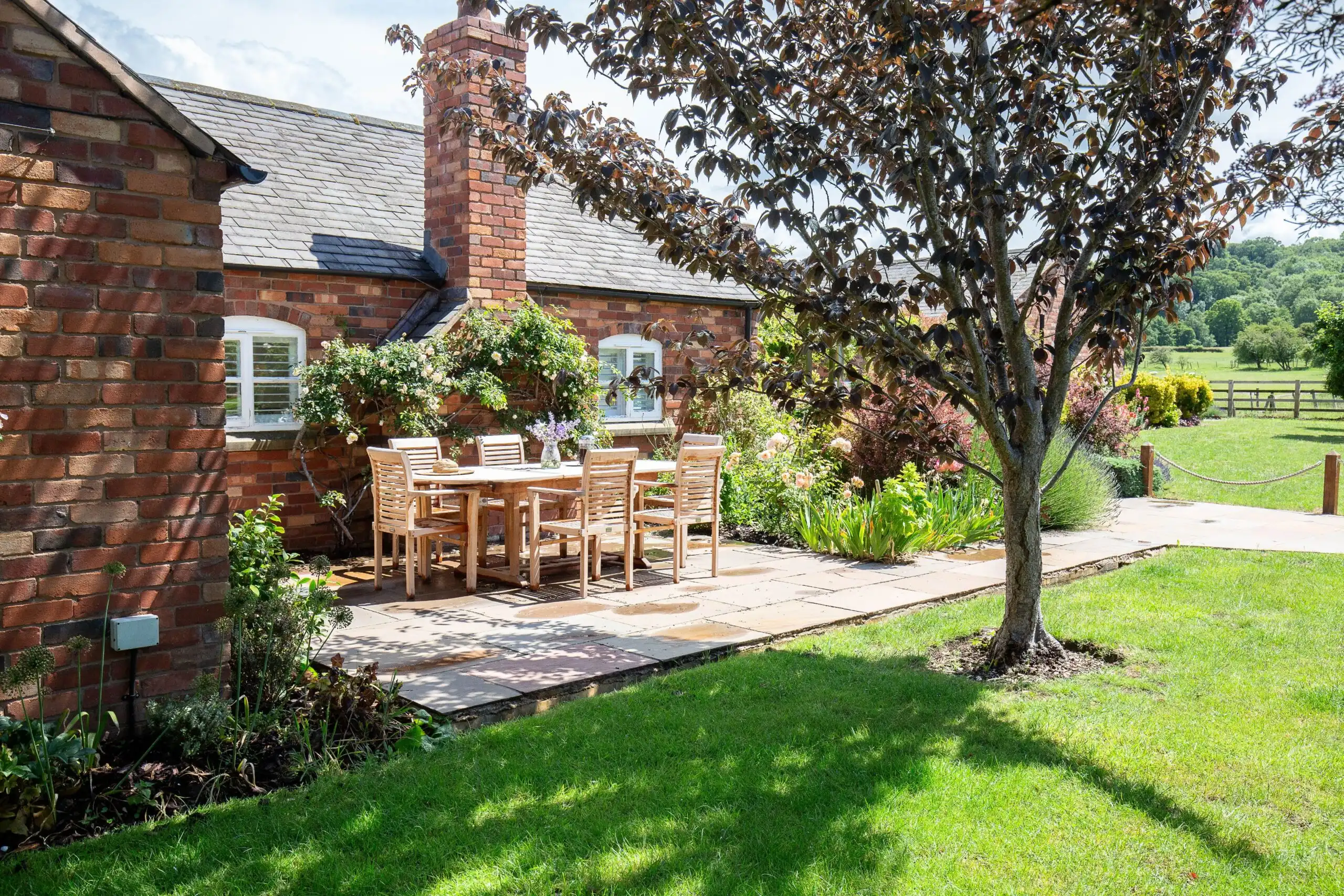 The private garden and terrace have views of the pastures and Cotswolds Escarpment