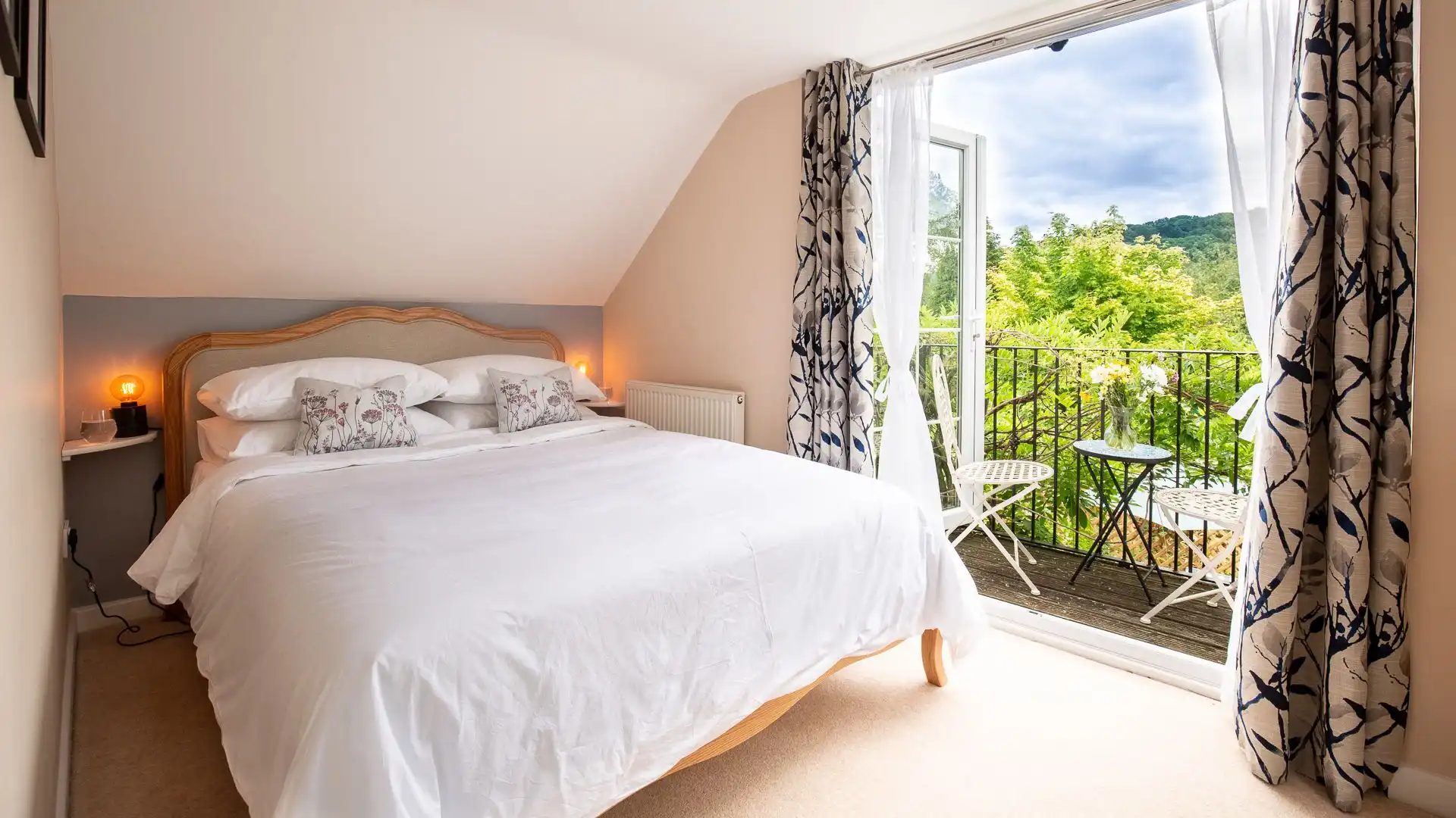 The master bedroom is elegantly styled and features a king-size bed.