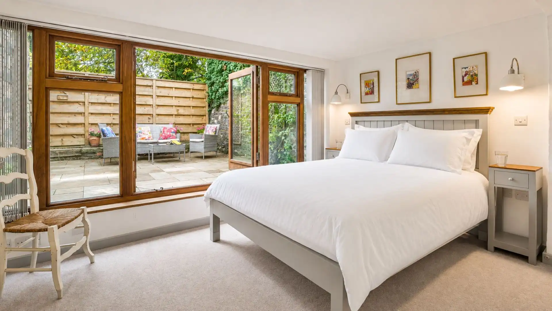 The elegant master bedroom features a king-size bed, East Barn.