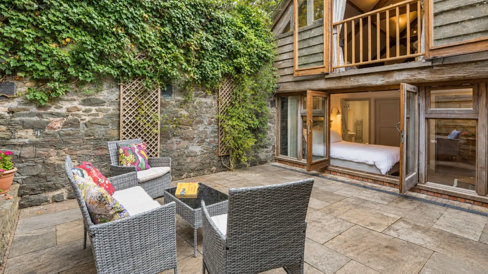 A Juliet balcony looks out onto the back garden, East Barn.