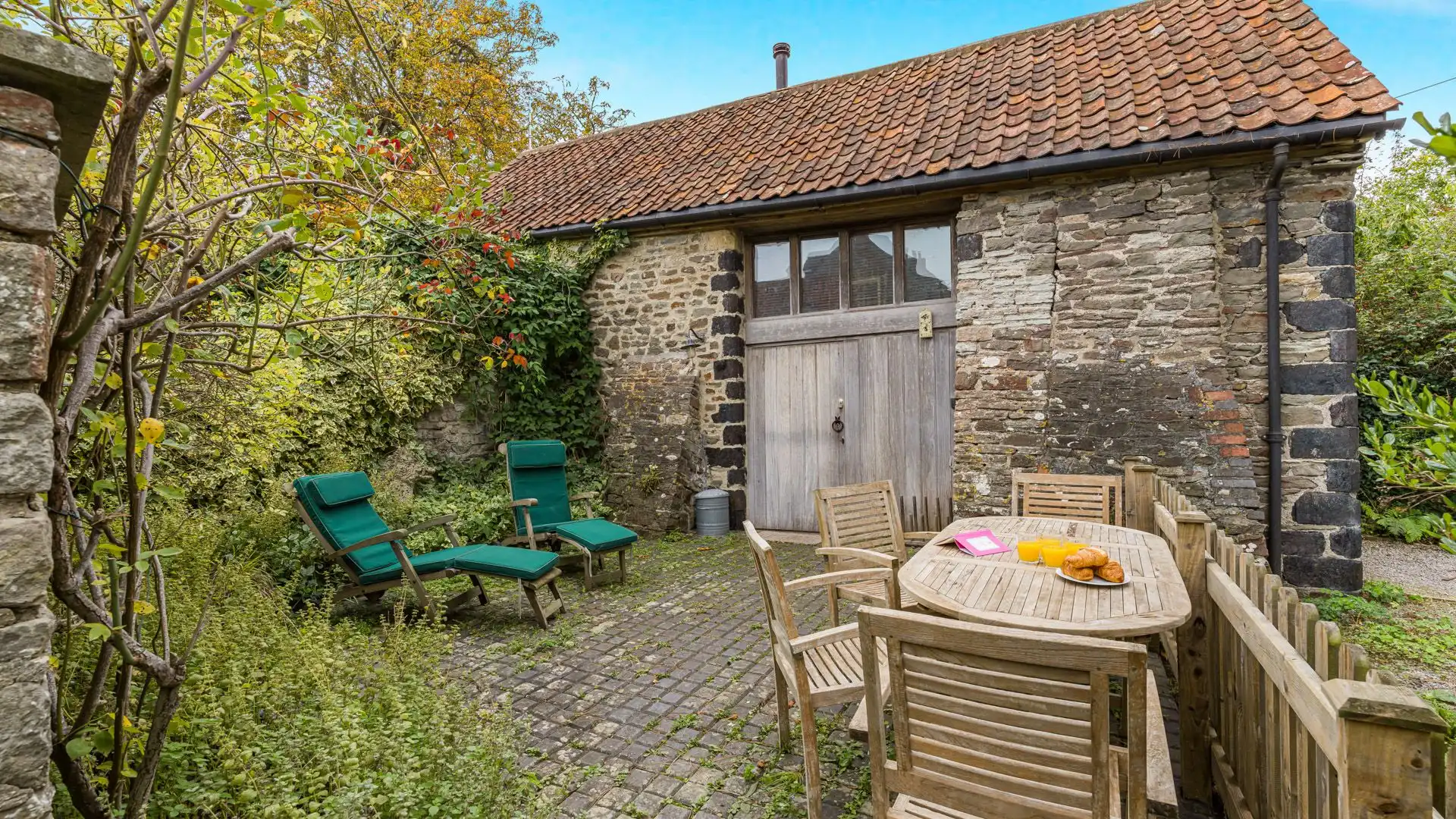 Dine alfresco in the front courtyard garden, East Garden.
